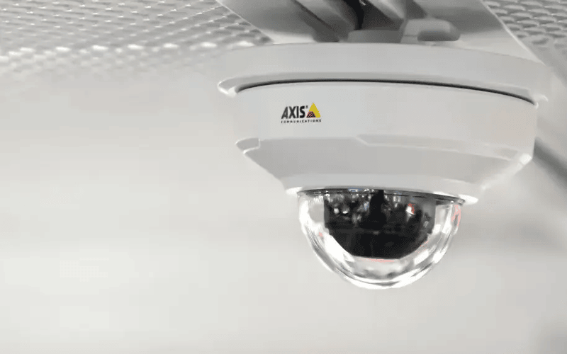 An office ceiling protected by an Axis Communications security camera.