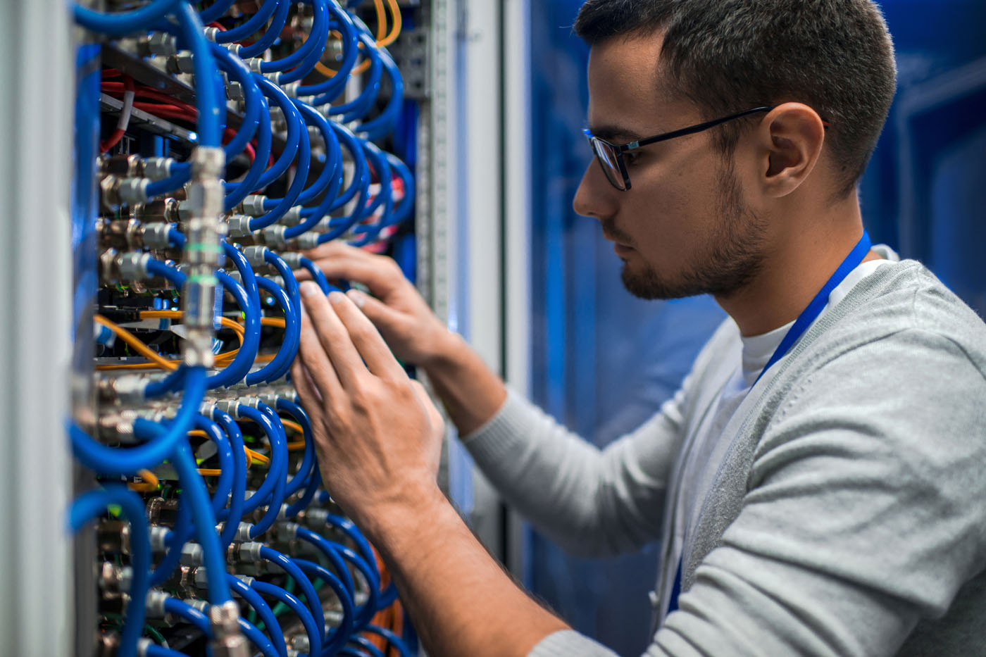 A technician working on data cables - trust LVEC, data cable installers, for all your cable needs.