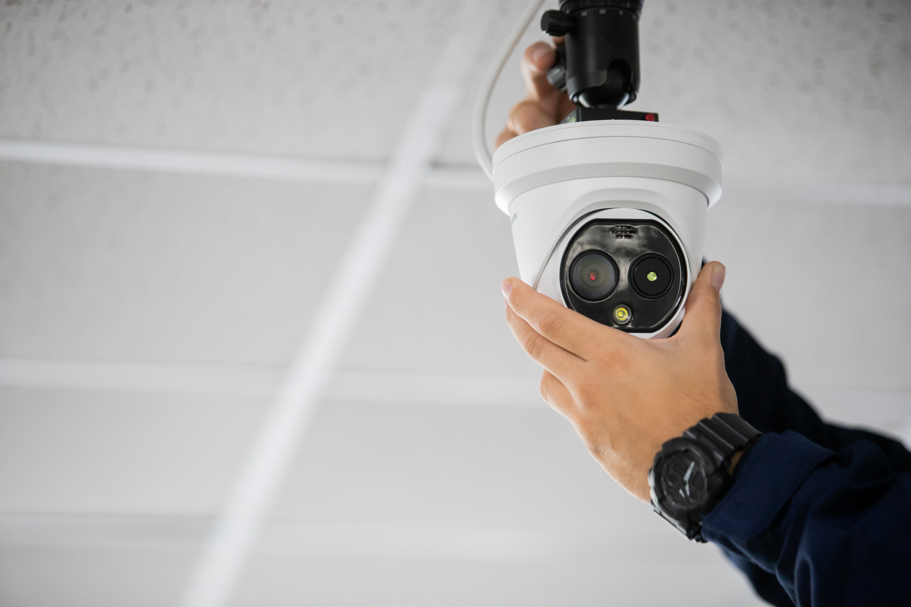 A LVEC technician installing a trusted camera product.